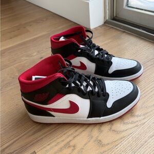 Nike Air Jordan 1 Mid Black, Red, and White Sneakers